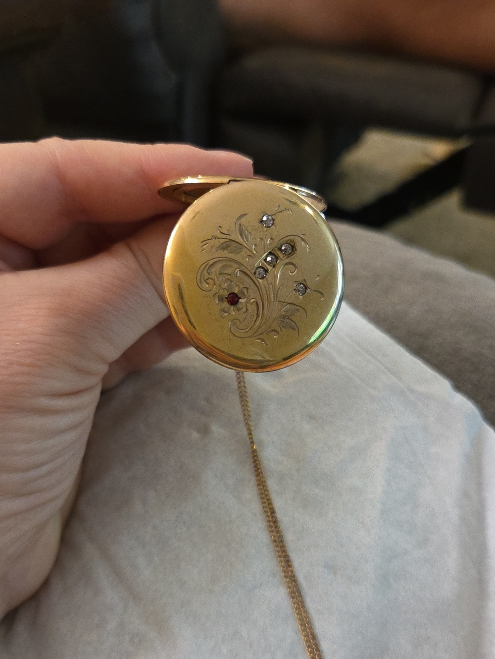 Gold-Tone Locket Necklace with Decorative Gem Accents